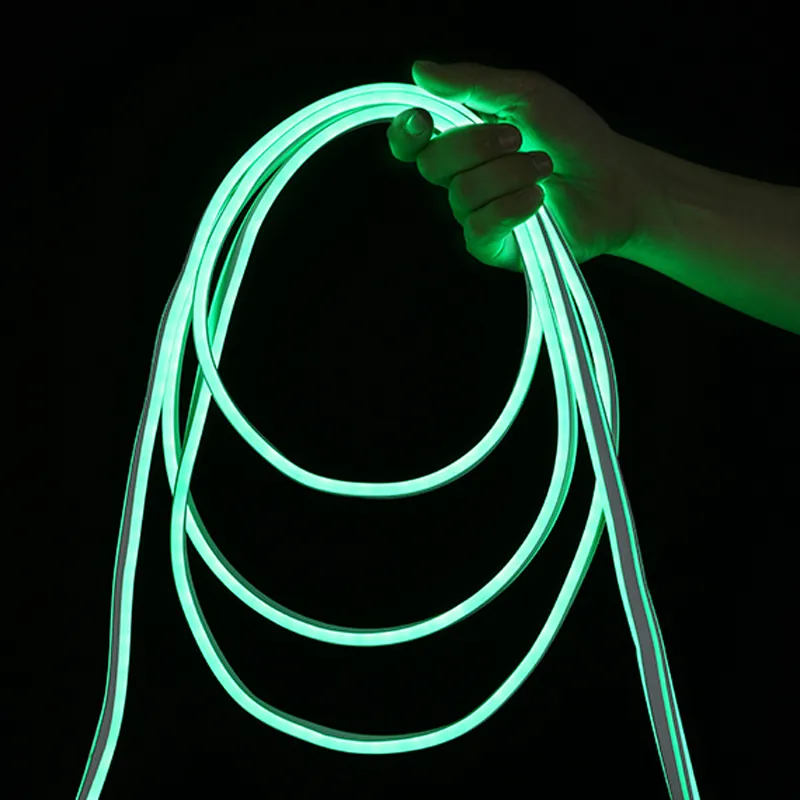 8x16mm double-brightness green LED neon flex light held by hand to demonstrate flexibility