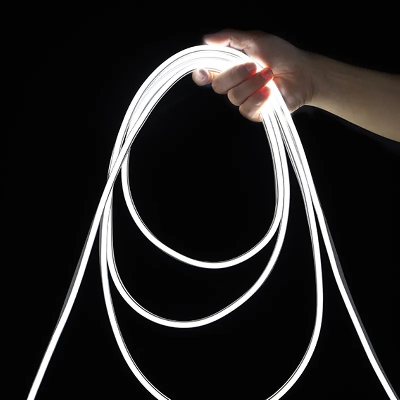 8x16mm double-brightness white LED neon flex light held by hand on a dark background