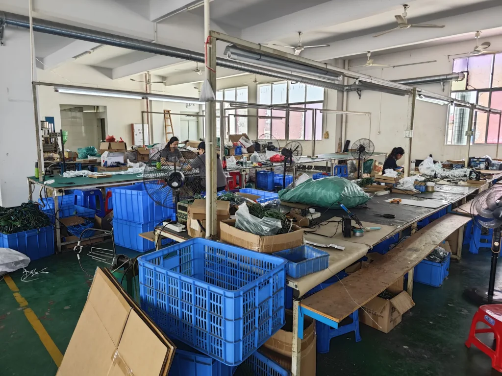 LUYUAN LIGHTING light string assembly workshop with production worktables and workers